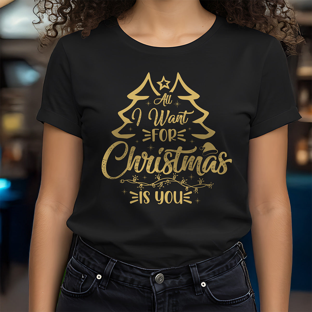 Person wearing a black t-shirt with gold Christmas-themed text