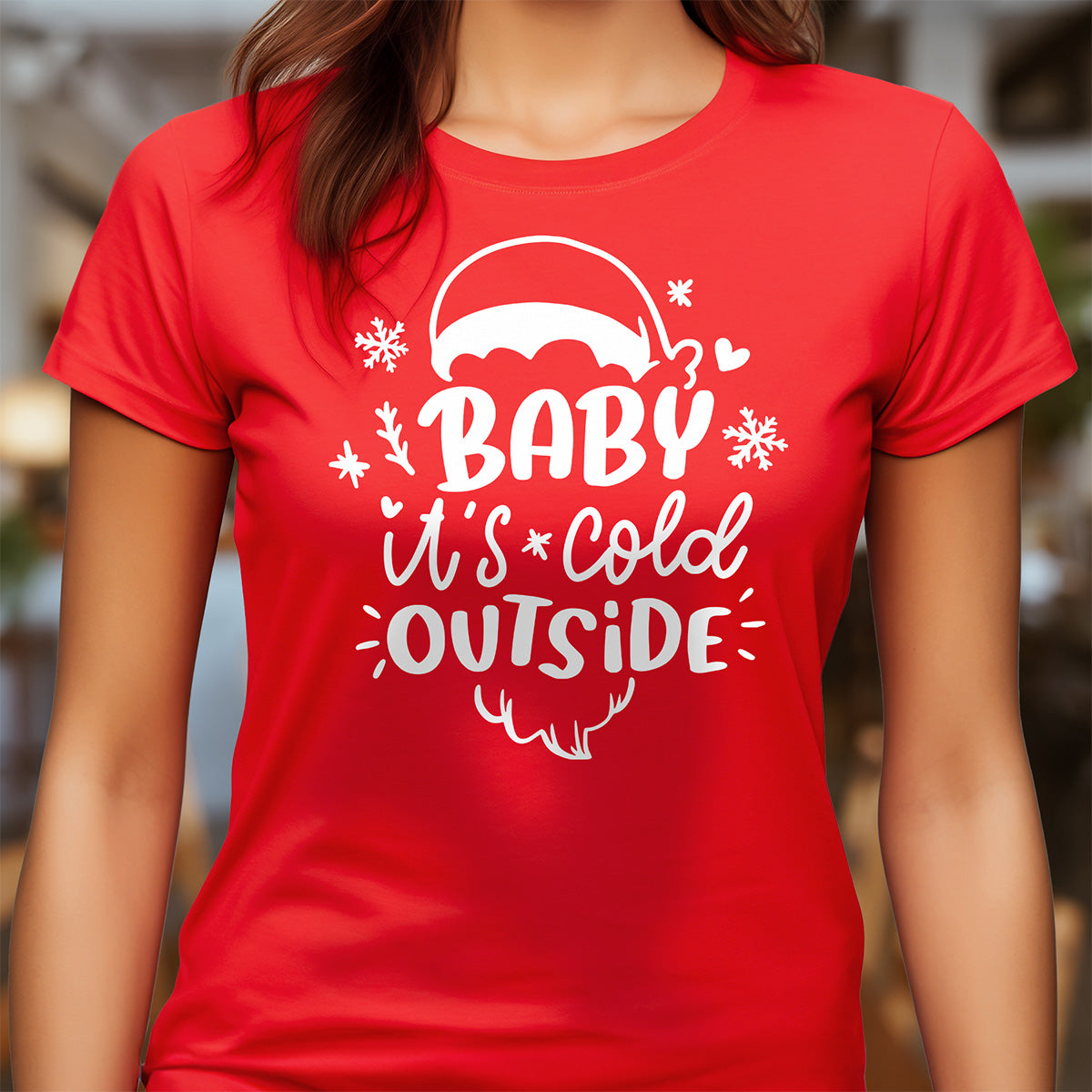 Red t-shirt with white text 'Baby It's Cold Outside' worn by a person.