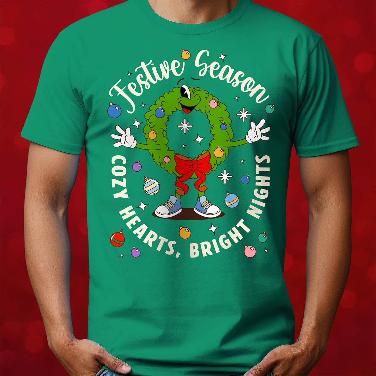 Green t-shirt with festive design featuring a wreath and text on a red background