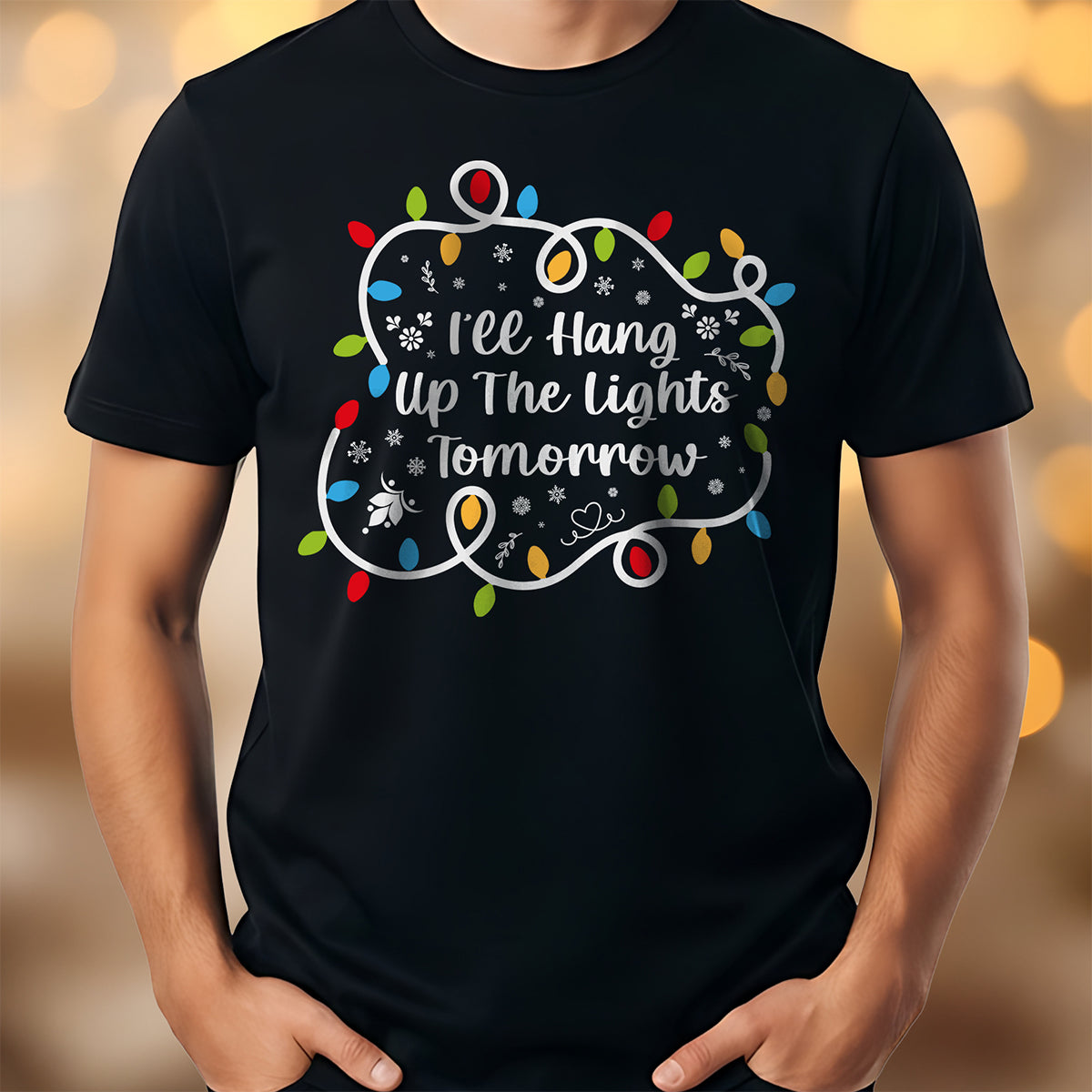Black t-shirt with Christmas lights design and text on a blurred background