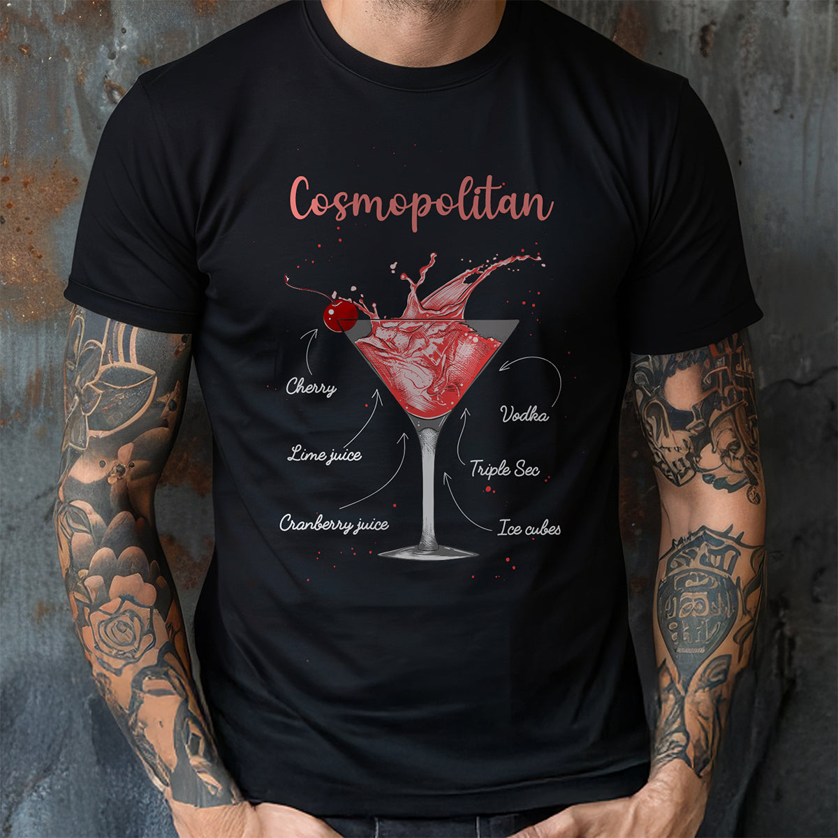 Black t-shirt with a cosmopolitan cocktail graphic and text, worn by a person with tattoos.