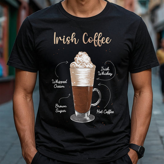 Person wearing a black t-shirt with an illustration of Irish coffee and text on a blurred street background