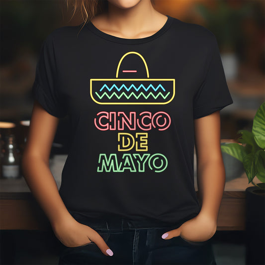 Person wearing a black t-shirt with colorful 'Cinco de Mayo' design.