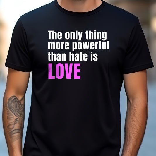 Black t-shirt with motivational quote 'The only thing more powerful than hate is LOVE' on a blurred background