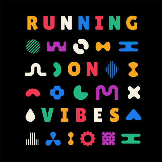 Close-up of black t-shirt with colorful 'RUNNING ON VIBES' illustrated design pattern.