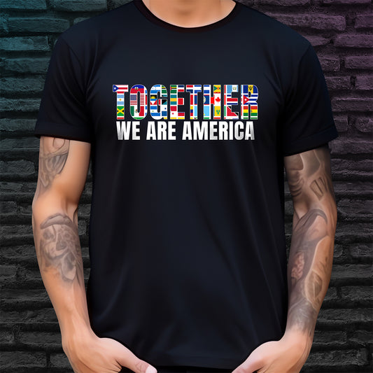 Person wearing a black t-shirt with 'Together We Are America' text and colorful design against a brick wall.