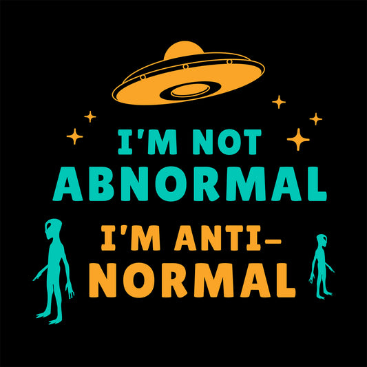 Cloe-up of black t-shirt with a illustrated alien design and humorous text "I'm Not Abnormal I'm Anti-Normal"