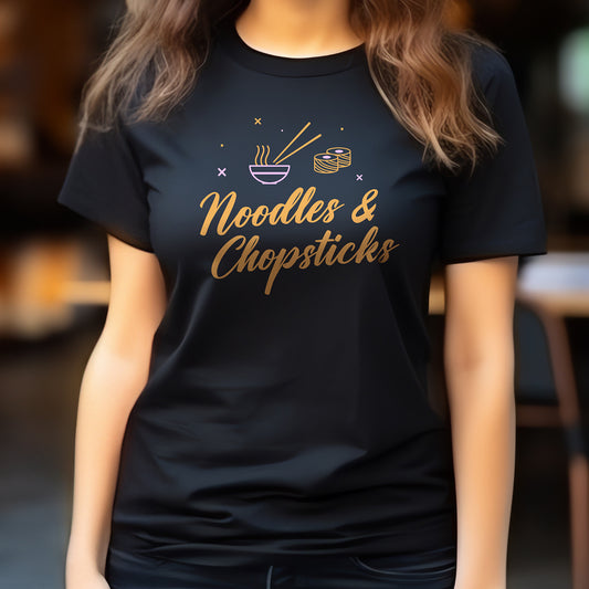 Black t-shirt with bright 'Noodles & Chopsticks' illustrated design